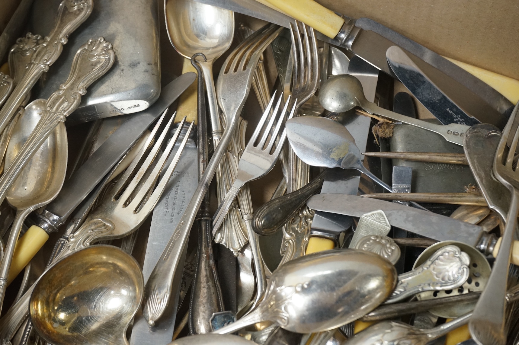 A pair of Victorian silver King's pattern table spoons by George Adams, London, 1858, a silver teaspoon, a mounted glass scent bottle, a silver cigarette case, a continental canister with inset coin lid, and assorted pla